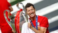 August 23, 2020 Bayern Munich's Robert Lewandowski celebrates with the trophy after winning the Champions League, as play resumes behind closed doors following the outbreak of the coronavirus disease (COVID-19) REUTERS/Matthew Childs/Pool
