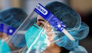 Medical personnel is pictured wearing a BYD Care N95 particulate respirator mask and a face shield while working at a pop-up testing centre for the coronavirus disease (COVID-19), as the state of New South Wales grapples with an outbreak of new cases, in 