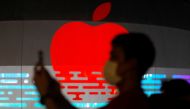 People take photos of the upcoming Apple store at the Marina Bay Sands in Singapore August 31, 2020. REUTERS/Edgar Su
