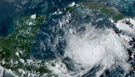 This NOAA/GOES satellite image shows Tropical Storm Nana (R) in the Caribbean at 22:00UTC, on September 1, 2020. Nana will pass near the coast of Honduras on September 2, before intensifying and reaching Belize one day later, the Miami-based National Hurr