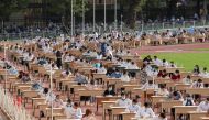 School graduates take university entrance exams at the Pakhtakor sports arena amid the outbreak of the coronavirus disease (COVID-19) in Tashkent, Uzbekistan September 2, 2020. REUTERS/Mukhammadsharif Mamatkulov