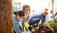 Prince Harry and Meghan Markle, the Duke and Duchess of Sussex, plant flowers and forget-me-nots during a visit to the Assistance League Los Angeles' Preschool Learning Center in Los Angeles, California, U.S. August 31, 2020, in this picture obtained from