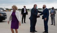 Democratic presidential candidate Joe Biden , with his wife Dr. Jill Biden (L), is greeted by US Senator Scott Fitzgerald as he arrives at Milwaukee Mitchell International Airport, in Milwaukee, Wisconsin, on September 3, 2020. / AFP / JIM WATSON
