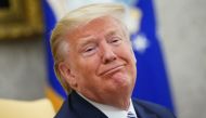 (FILES) In this file photo US President Donald Trump smiles as he meets with Florida Governor Ron DeSantis in the Oval Office of the White House in Washington, DC on April 28, 2020. / AFP / MANDEL NGAN