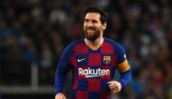 In this file photo taken on March 01, 2020, Barcelona's Argentine forward Lionel Messi smiles during the Spanish League football match between Real Madrid and Barcelona at the Santiago Bernabeu stadium in Madrid. / AFP / GABRIEL BOUYS