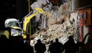 Rescue workers dig through the rubble of a building in the Lebanese capital's Gemmayze area on September 5, 2020.  AFP / ANWAR AMRO