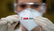 FILE PHOTO: A nurse holds China's Sinovac vaccine, a potential vaccine for the coronavirus disease (COVID-19), at the Sao Lucas Hospital of the Pontifical Catholic University of Rio Grande do Sul (PUCRS), in Porto Alegre, Brazil August 8, 2020. REUTERS/Di
