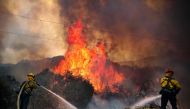San Miguel County Firefighters battle a brush fire along Japatul Road during the Valley Fire in Jamul, California on September 6, 2020 The Valley Fire in the Japatul Valley burned 4,000 acres overnight with no containment and 10 structures destroyed, Cal 