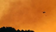 HATAY, TURKEY - SEPTEMBER 07: A helicopter carries water to drop over a wildfire in Antakya district of Turkey's Hatay province on September 07, 2020. ( Muzaffer Ça?l?yaner - Anadolu Agency )