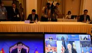 Vietnam's Foreign Minister Pham Binh Minh (L) and US Secretary of State Mike Pompeo (C, on screen at R) are seen on monitor screens during the Association of Southeast Asian Nations (ASEAN)-US Ministerial Meeting, held online due to the COVID-19 novel cor