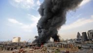 TOPSHOT - Lebanese firefighters try to put out a fire that broke out at Beirut's port area, on September 10, 2020. / AFP / ANWAR AMRO