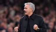 In this file photo taken on November 26, 2019 Tottenham Hotspur's Portuguese head coach Jose Mourinho celebrates as Tottenham Hotspur's English striker Harry Kane (unseen) scores his team's second goal during the UEFA Champions League Group B football mat