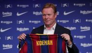 Barcelona unveil new coach Ronald Koeman - Auditorium 1899, Barcelona, Spain - August 19, 2020 Barcelona coach Ronald Koeman poses with a Barcelona shirt during the unveiling REUTERS/Albert Gea/File Photo