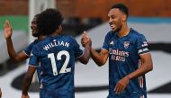 Arsenal's Gabonese striker Pierre-Emerick Aubameyang (R) celebrates scoring their third goal with Arsenal's Brazilian midfielder Willian (L) during the English Premier League football match between Fulham and Arsenal at Craven Cottage in London on Septemb