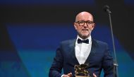 Disney's Marketing Director for Italy, Davide Romani acknowledges receiving the Golden Lion for Best Film on behalf of US director Chloe Zhao for 