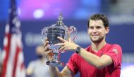 Dominic Thiem of Austria celebrates with championship trophy after winning in a tie-breaker during his Men's Singles final match against Alexander Zverev of Germany on Day Fourteen of the 2020 US Open at the USTA Billie Jean King National Tennis Center on