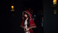 This photo taken on August 13, 2020 shows a player taking part in the live action role-play (LARP) murder mystery game 