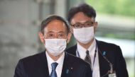 Japan's new Prime Minister Yoshihide Suga (L) arrives at his office in Tokyo on September 16, 2020. AFP / Kazuhiro Nogi 