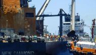This handout picture was taken on September 10, 2020, and released on September 11, 2020 by Sri Lanka Navy shows international salvage experts boarding the fire-stricken tanker, New Diamond, in the Indian Ocean off Sri Lanka's eastern coast./ AFP / Sri La