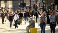 Shoppers, some wearing a face mask or covering due to the COVID-19 pandemic, walk in Newcastle city centre, north-east England, on September 17, 2020. AFP / Oli SCARFF