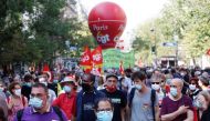 Demonstrators, wearing protective face masks, attend a demonstration against job cuts and for salary increases during the economic crisis and the coronavirus disease (COVID-19) outbreak in Paris, France, September 17, 2020. REUTERS/Gonzalo Fuentes
