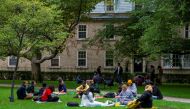 People sit on the grounds of the University of Toronto in Toronto, Ontario, Canada September 9, 2020. Picture taken September 9, 2020. REUTERS/Carlos Osorio

