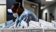 (FILES) In this file photo taken on August 13, 2020, Biotechnology company Moderna protocol files for Covid-19 vaccinations are kept at the Research Centers of America in Hollywood, Florida. / AFP / CHANDAN KHANNA
