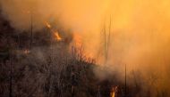 A wildfire burns in the Angeles National Forest during the Bobcat Fire in Los Angeles, California, U.S., September 17, 2020. REUTERS/Ringo Chiu