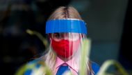 A restaurant employee wears a protective face shield and mask due to the coronavirus disease (COVID-19) outbreak in Moscow, Russia July 8, 2020. REUTERS/Maxim Shemetov/File Photo