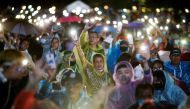 Pro-democracy protesters light up their mobile phones as they attend a mass rally to call for the ouster of Prime Minister Prayuth Chan-ocha's government and reforms in the monarchy, in Bangkok, Thailand, September 19, 2020. REUTERS/Soe Zeya Tun