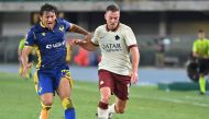 Verona's defender Andrea Danzi (L) fights for the ball with AS Roma's Turkish forward Cengiz Under during the Italian Serie A football match Verona vs As Roma on September 19, 2020 at Marcantonio Bentegodi stadium in Verona. / AFP / Alberto PIZZOLI
