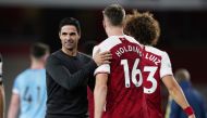 Arsenal manager Mikel Arteta and Arsenal's Rob Holding. REUTERS/Will Oliver