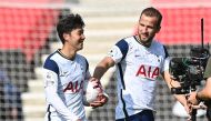 Tottenham Hotspur's Son Heung-min celebrates with the match ball and Harry Kane after the match. REUTERS/Justin Tallis 