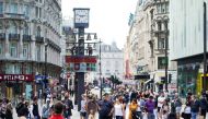People watch a street performer in Leicester Square, amid the coronavirus disease (COVID-19) outbreak, in London, Britain, September 20, 2020. REUTERS/Henry Nicholls
