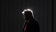 US President Donald Trump looks on as he departs a rally at Toledo Express Airport in Swanton, Ohio on September 21, 2020. / AFP / MANDEL NGAN
