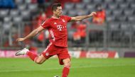Bayern Munich's Polish forward Robert Lewandowski scores the third goal from the penalty spot during the German first division Bundesliga football match FC Bayern Munich v Schalke 04 in Munich, southern Germany on September 18, 2020. AFP / CHRISTOF STACHE