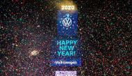 FILE PHOTO: Confetti flies around the ball and countdown clock in Times Square in the Manhattan borough of New York, U.S., January 1, 2020. REUTERS/Jeenah Moon/File Photo
