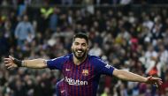 (FILES) In this file photo taken on February 27, 2019 Barcelona's Uruguayan forward Luis Suarez celebrates his second goal during the Spanish Copa del Rey (King's Cup) semi-final second leg football match between Real Madrid and Barcelona at the Santiago 