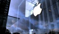 FILE PHOTO: The Apple Inc. logo is seen hanging at the entrance to the Apple store on 5th Avenue in Manhattan, New York, U.S., October 16, 2019. REUTERS/Mike Segar