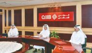 Sheikh Dr. Khalid bin Thani bin Abdullah Al Thani (centre), Umnia Bank Chairman, and Chairman of the Board of Directors and Managing Director at QIIB, and other senior officials of the Group chairing the board meeting for Umnia Bank recently. 
