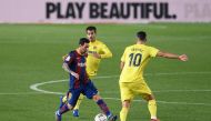 Villarreal's Spanish midfielder Manuel Trigueros (C) and Villarreal's Spanish midfielder Vicente Iborra (R) challenge Barcelona's Argentinian forward Lionel Messi during the Spanish league football match FC Barcelona against Villarreal CF at the Camp Nou 