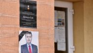 An obituary photo of former mayor Aliman Ion is taped onto the walls of the city hall in Deveselu, southern Romania, September 28, 2020. Inquam Photos/Bogdan Danescu via REUTERS 