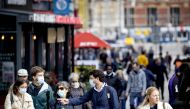 People, some wearing face masks, walk on a shopping street in Amsterdam, on September 29, 2020. / AFP / ANP / Koen van Weel