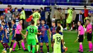 Players shake hands at the end of the Spanish league football match SD Huesca against Club Atletico de Madrid at the El Alcoraz stadium in Huesca on September 30, 2020. / AFP / Pau BARRENA
