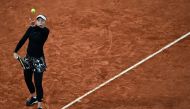 Latvia's Jelena Ostapenko serves the ball to Czech Republic's Karolina Pliskova during their women's singles second round tennis match on Day 5 of The Roland Garros 2020 French Open tennis tournament in Paris on October 1, 2020. AFP / MARTIN BUREAU