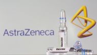  A test tube labelled with the Vaccine is seen in front of AstraZeneca logo in this illustration taken, September 9, 2020. REUTERS/Dado Ruvic/File Photo