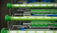 In this file photo taken on April 30, 2018 logos of supermarket chain Asda are pictured on the handles of shopping trolleys outside a store in Stockport, northern England US retail giant Walmart has agreed to sell its British supermarket chain Asda to two