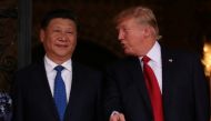 FILE PHOTO: U.S. President Donald Trump talks with Chinese President Xi Jinping as Xi arrives for dinner at the start of their summit at Trump’s Mar-a-Lago estate in West Palm Beach, Florida, U.S. April 6, 2017. REUTERS/Carlos Barria