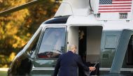 U.S. President Donald Trump boards the Marine One helicopter to depart the White House and fly to Walter Reed National Military Medical Center, where it was announced he will stay for at least several days after testing positive for the coronavirus diseas