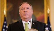 In this file photo taken on September 21, 2020 US Secretary of State Mike Pompeo speaks during a news conference to announce the Trump administration's restoration of sanctions on Iran, at the US State Department in Washington,DC. US Secretary of State Mi